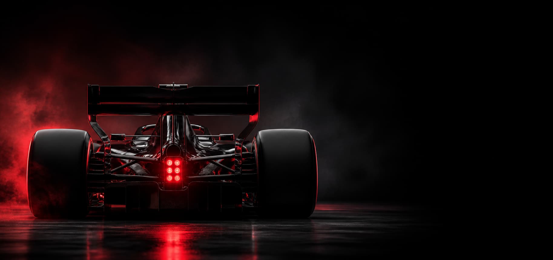 Rear view of a Formula-style race car with a red rain light.